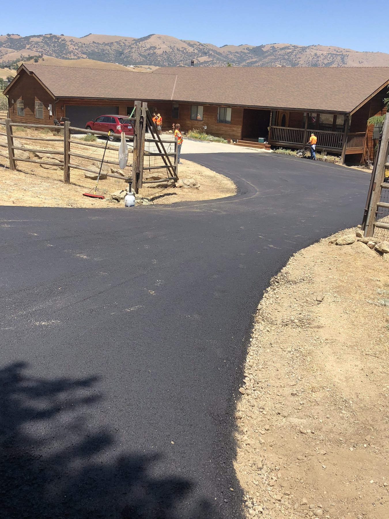 A newly paved asphalt driveway